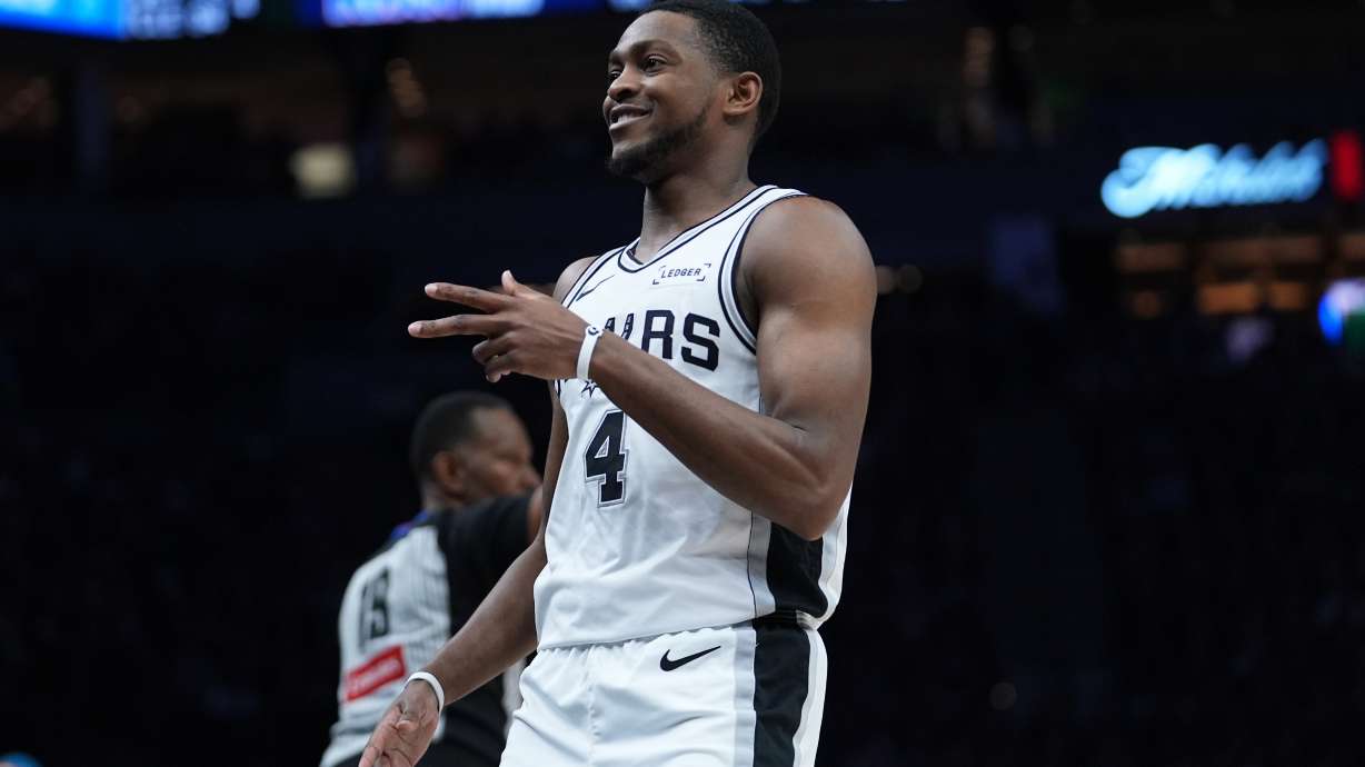 San Antonio Spurs guard De'aaron Fox (4) reacts after scoring against the Minnesota Timberwolves during the second half of Game 6 of an NBA basketball second-round playoffs series in Minneapolis, Friday, May 15, 2026.