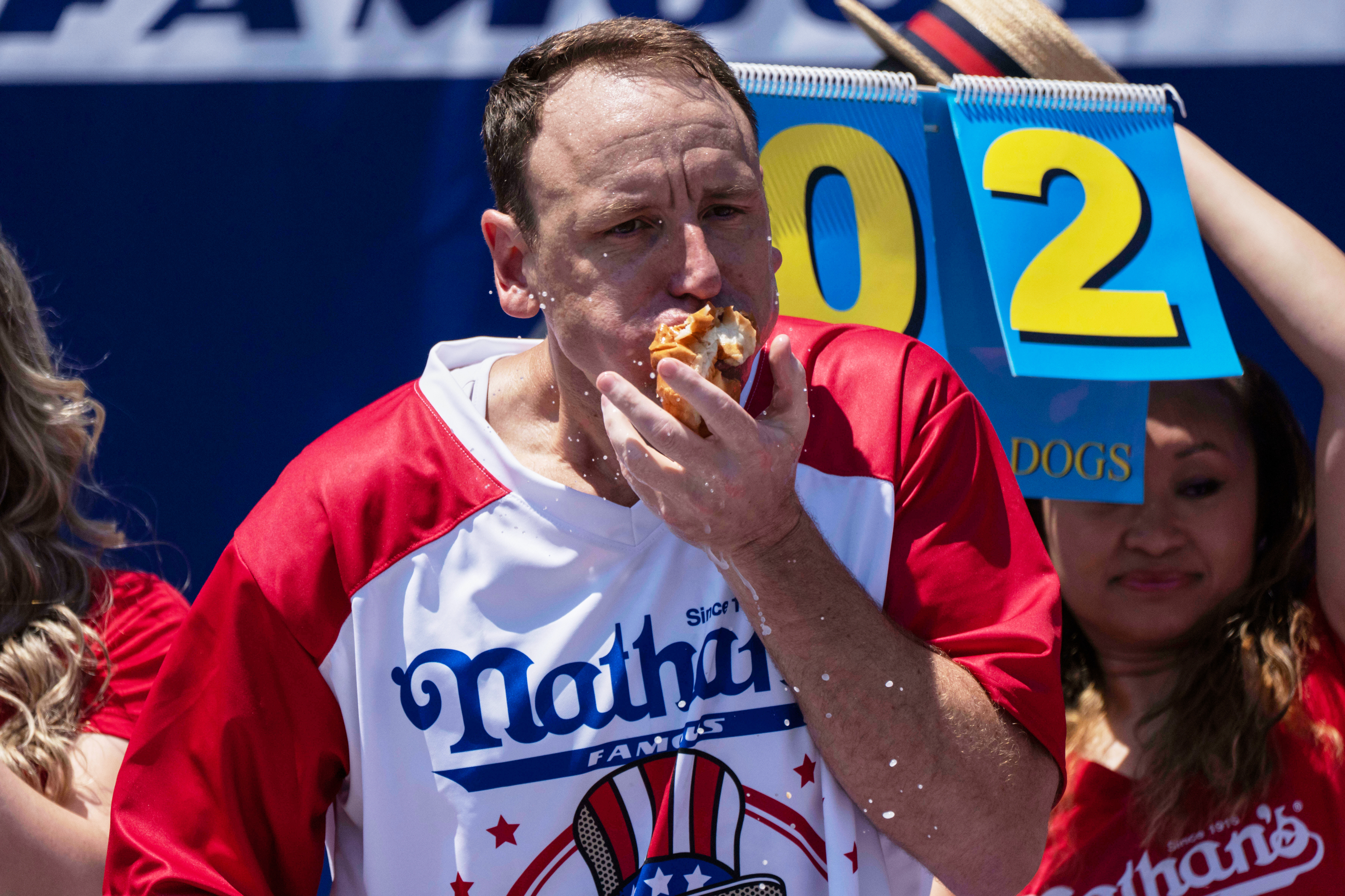 Joey Chestnut to defend hot dog eating title while on probation after pleading guilty to battery