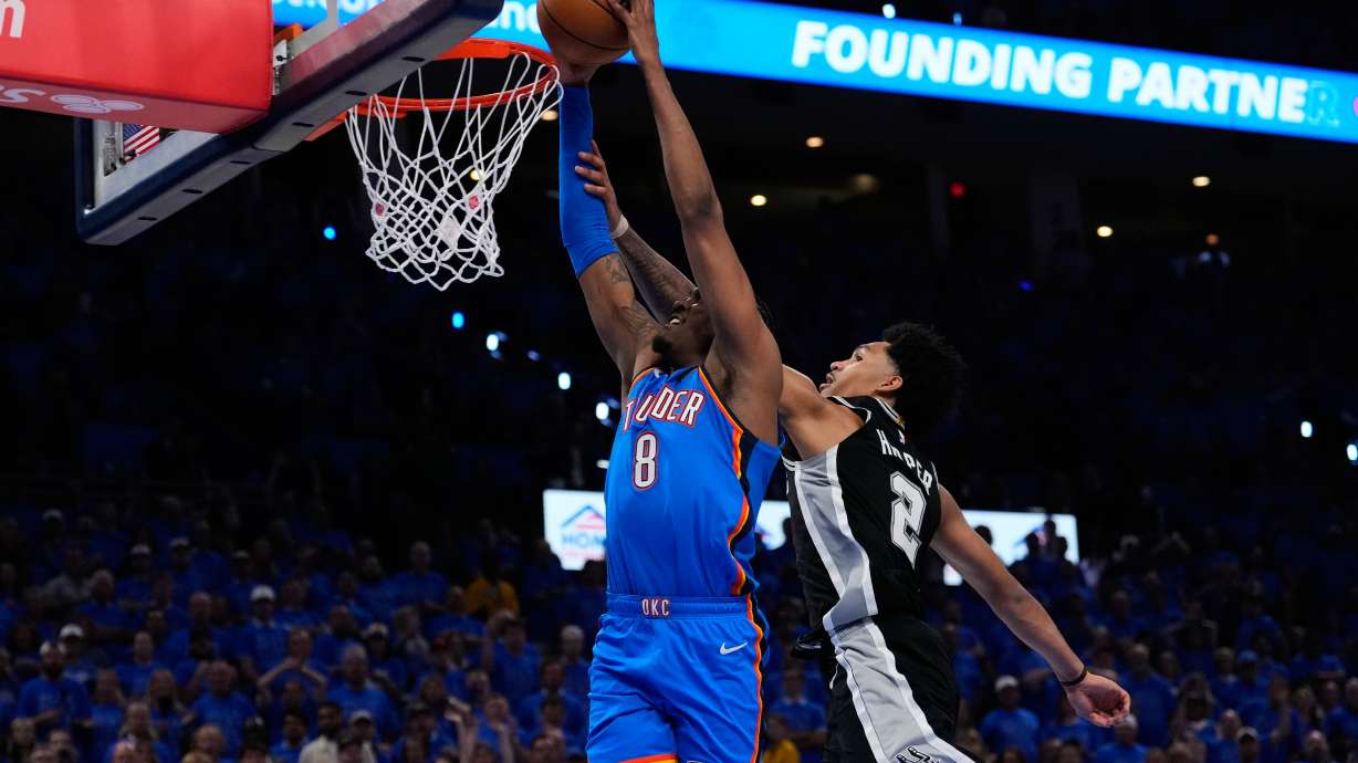 Oklahoma City Thunder guard Jalen Williams (8) shoots against San Antonio Spurs guard Dylan Harper (2) during overtime of Game 1 in a third-round NBA basketball playoffs series Monday, May 18, 2026, in Oklahoma City.