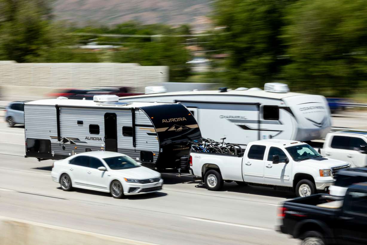 Trucks towing travel trailers drive southbound on I-15 in Lehi on Friday, May 23, 2025.