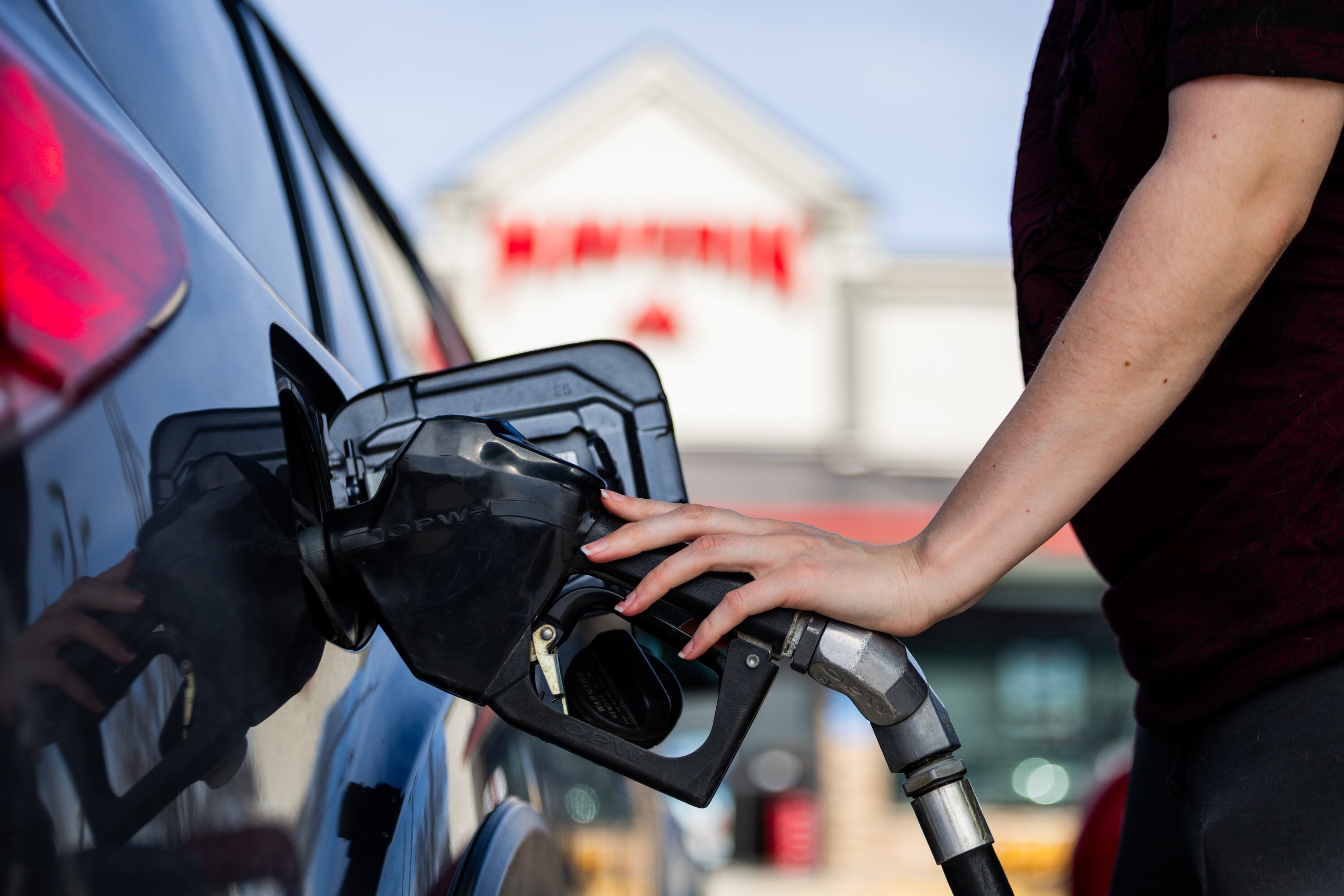 An individual fills up their car with gas at a Maverik gas station in Herriman on March 12.