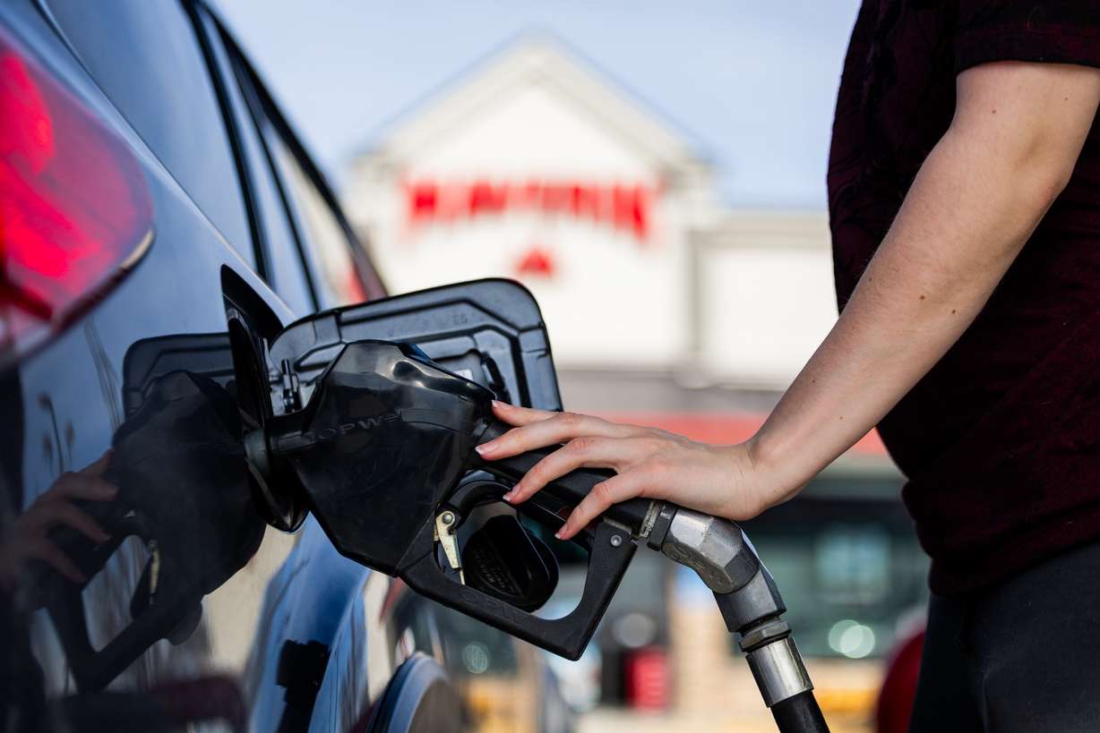 An individual fills up their car with gas at a Maverik gas station in Herriman on March 12.