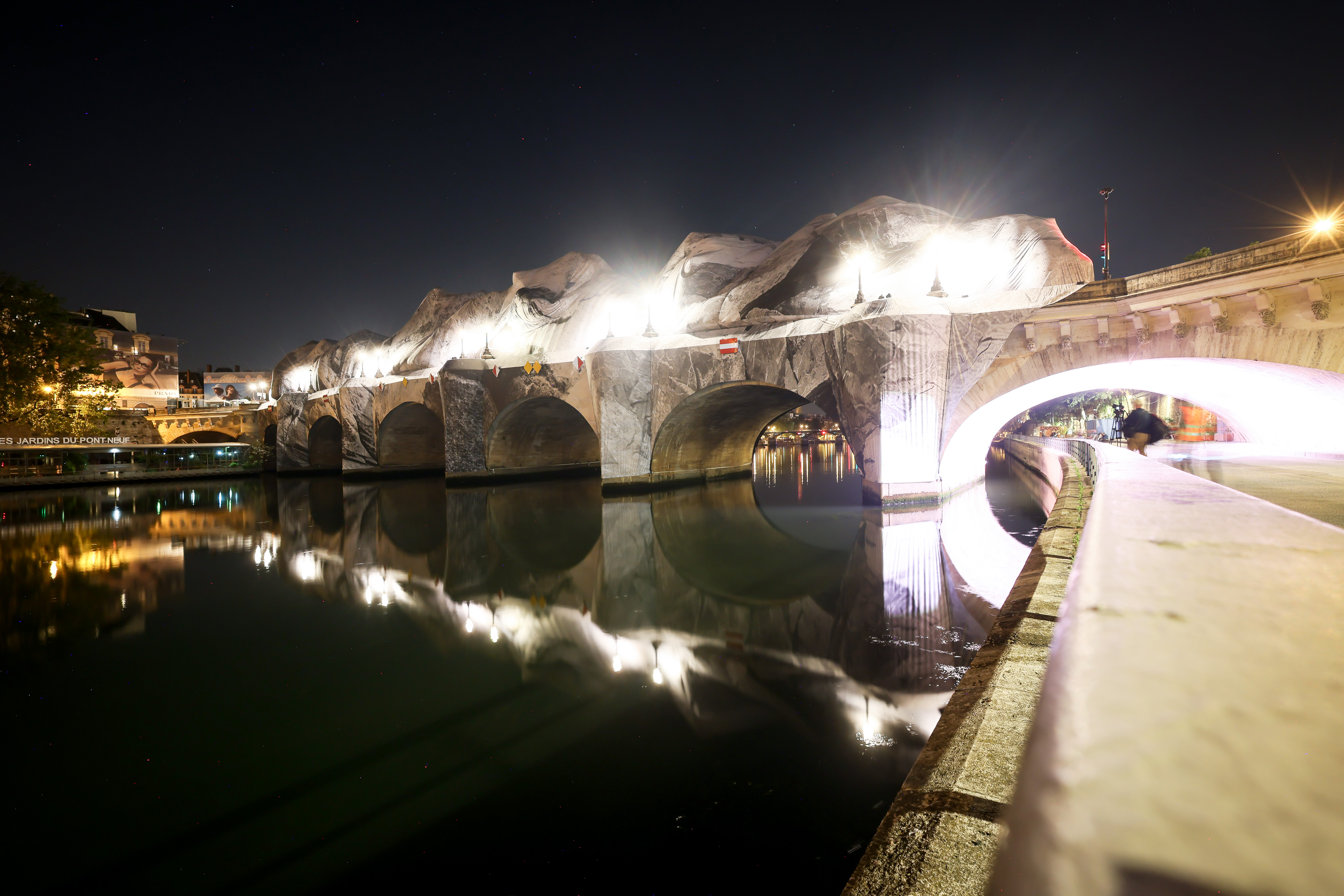 Inflation of the artwork "The Pont Neuf Cave" by French street artist JR on the Pont Neuf bridge, Thursday, in Paris, before its free opening to the public from June 6 to June 28. The inflation was carried out overnight after the recent bad weather.