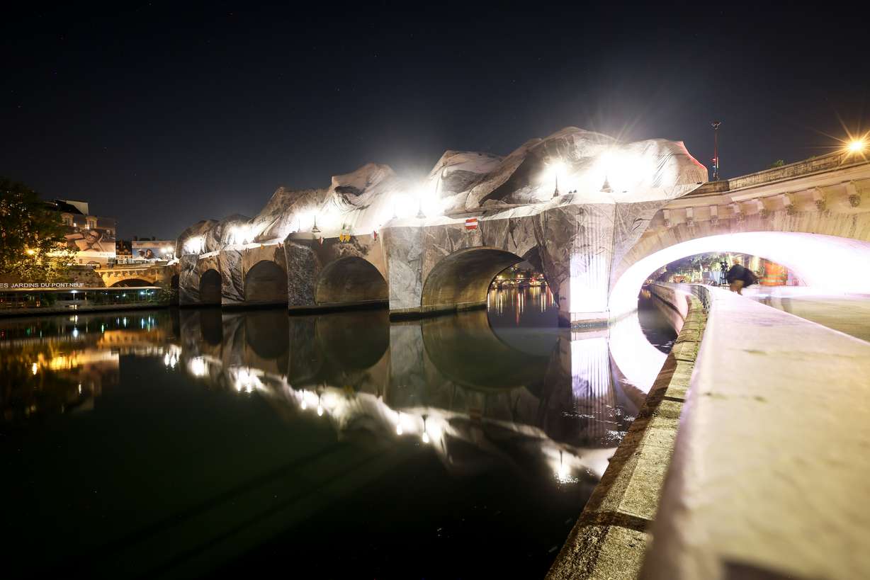 Inflation of the artwork "The Pont Neuf Cave" by French street artist JR on the Pont Neuf bridge, Thursday, in Paris, before its free opening to the public from June 6 to June 28. The inflation was carried out overnight after the recent bad weather.
