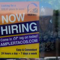 Jobless aid filings fell to 209,000 last week as layoffs remain low despite economic uncertainty