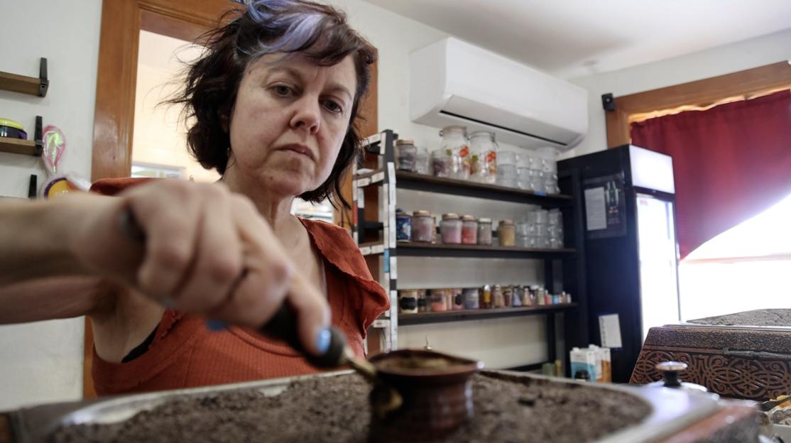 Elif Ekin prepares traditional Turkish coffee at Kahve Café in Salt Lake City. She opened the café five years ago and thought business was going well, then discovered one of her managers had been stealing from her.
