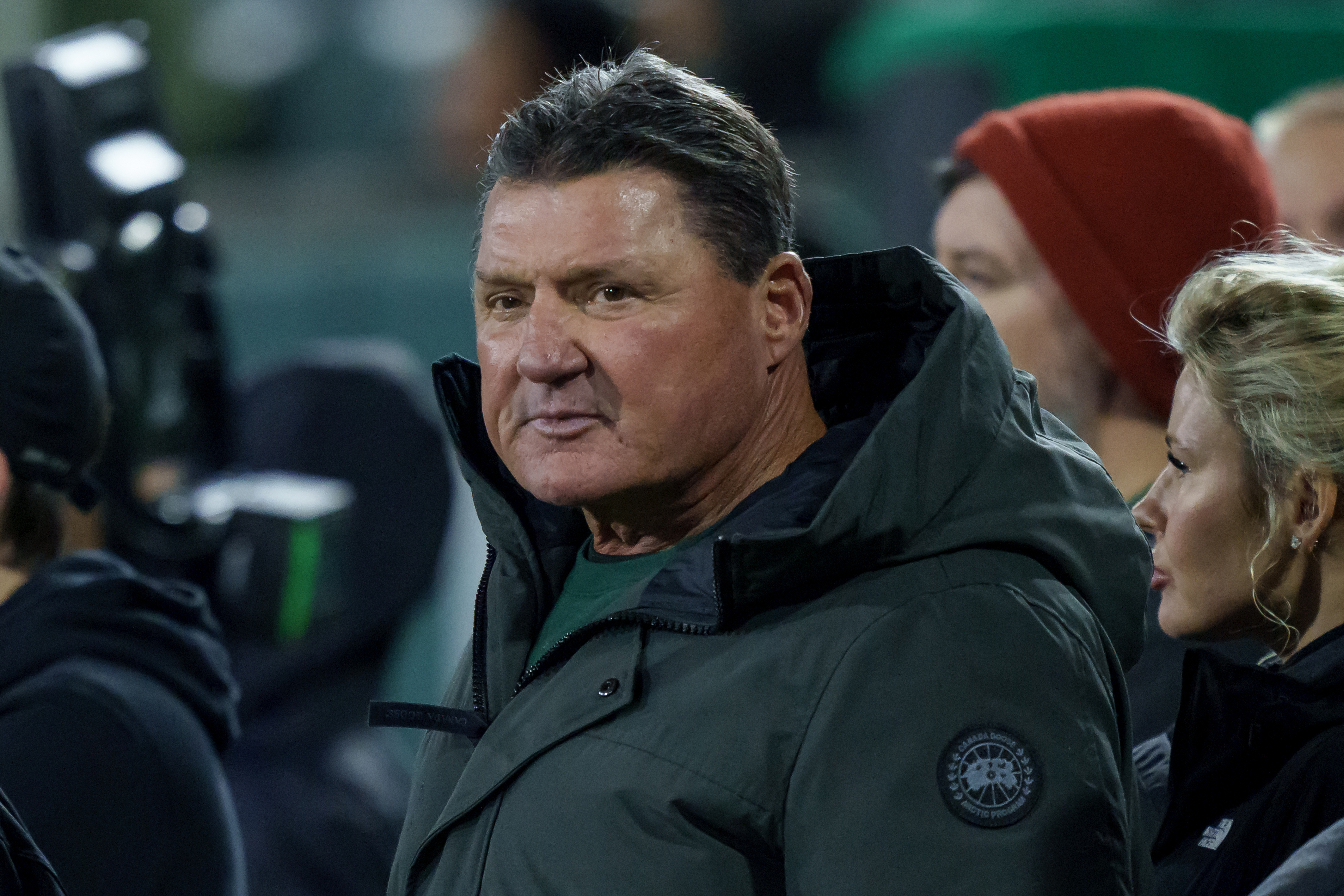 FILE - Former LSU head coach Ed Orgeron and Brandy Nicole, right, watch the American Conference championship NCAA college football game against North Texas in New Orleans, on Dec. 5, 2025. 