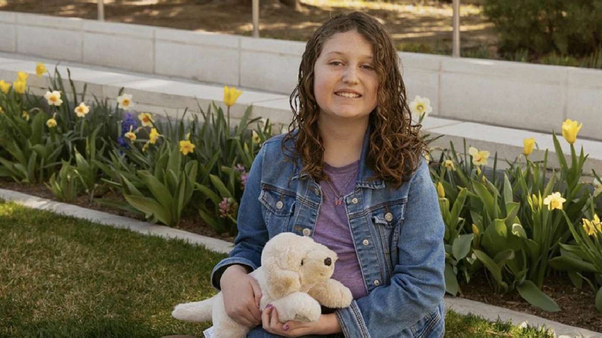 Emma Hill poses with her stuffed animal Daisy. Emma’s best friend gave her Daisy during her first hospital stay, and Daisy has since gone with Emma to every radiation treatment.