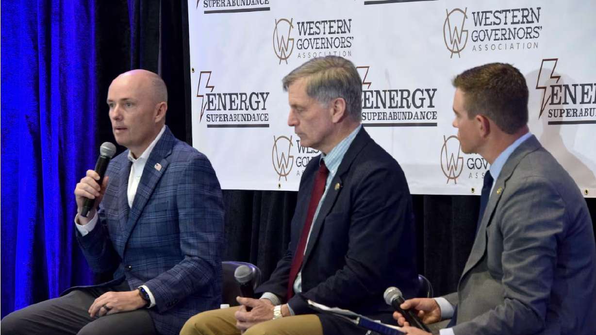 Utah Gov. Spencer Cox, Wyoming Gov. Mark Gordon and WGA Exec. Dir. Jack Waldorf discuss permitting during a Western Governors Association panel in Salt Lake City on Wednesday.