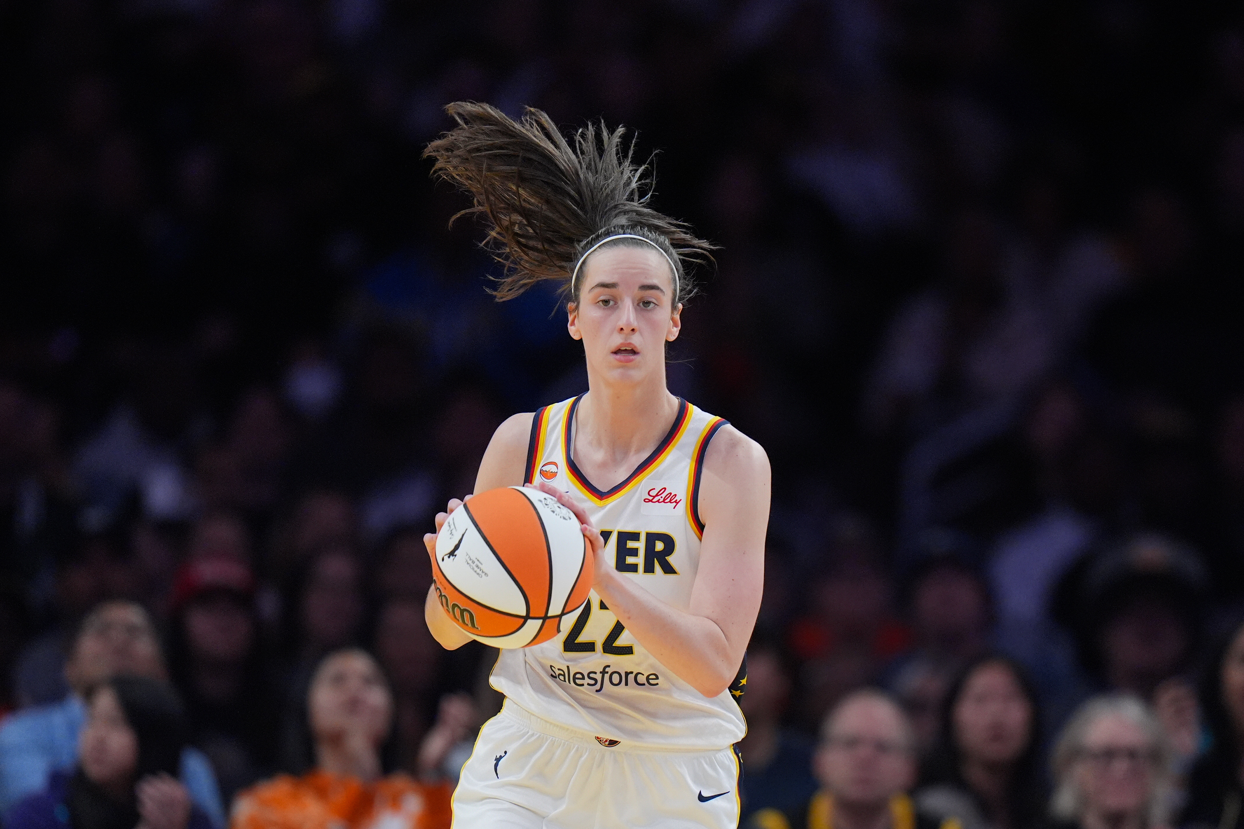 Indiana Fever guard Caitlin Clark (22) dribbles during the first half of a WNBA basketball game against the Los Angeles Sparks Wednesday, May 13, 2026, in Los Angeles. 