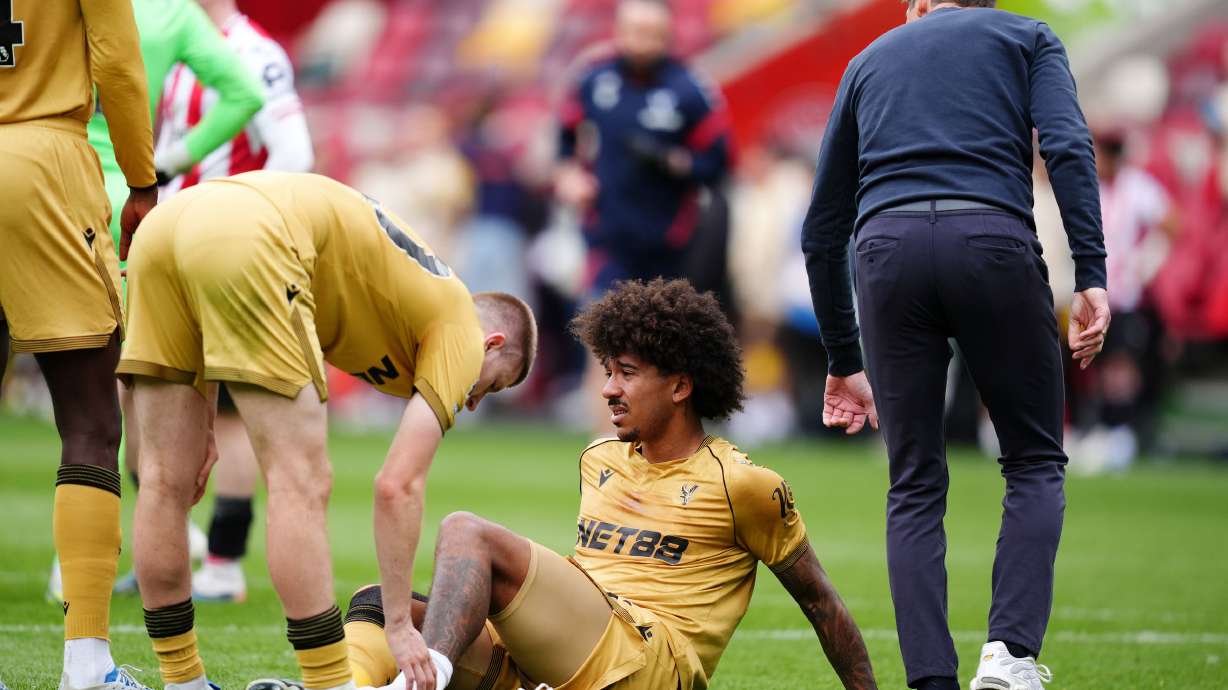 Crystal Palace's Chris Richards, bottom, reacts after after going down with an injury during the Premier League soccer match between Brentford and Crystal Palace, Sunday, May 17, 2026, in London.