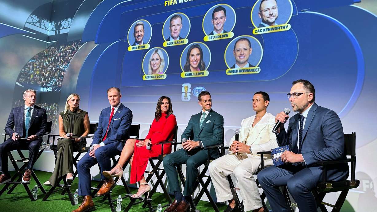 Fox Sports hosts, from left, Rob Stone and Rebecca Lowe, and former player/analysts Alexi Lalas, Stu Holden and Javier Hernandez listen as Fox Sports' vice president of production Zac Kenworthy speaks during a World Cup soccer new conference, Thursday, May 21, 2026, in New York.