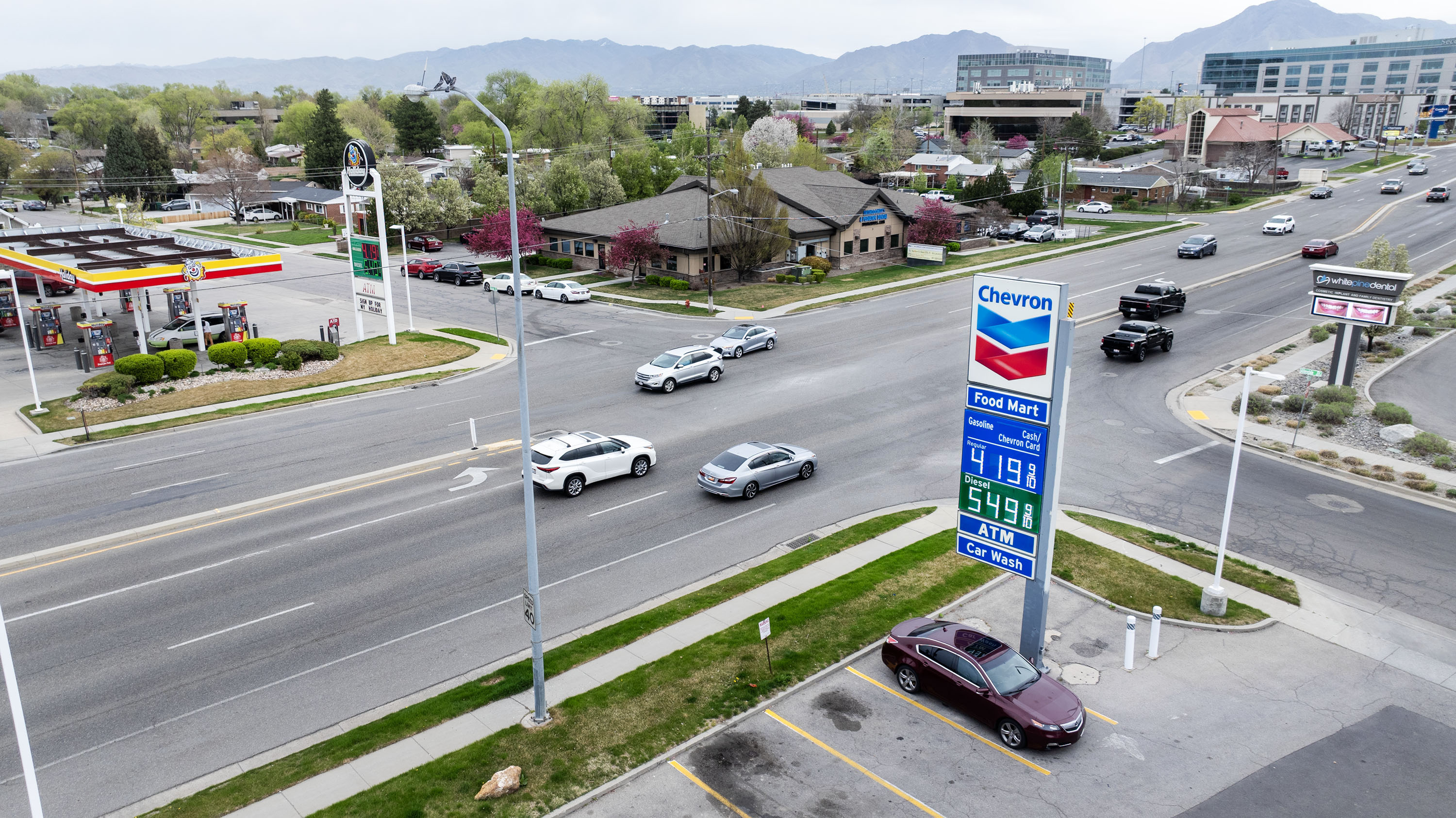 Chevron and Holiday gas prices in Murray on March 31. Despite higher gas prices this weekend, experts say Memorial Day travel is expected to keep Utah roads busy this year.