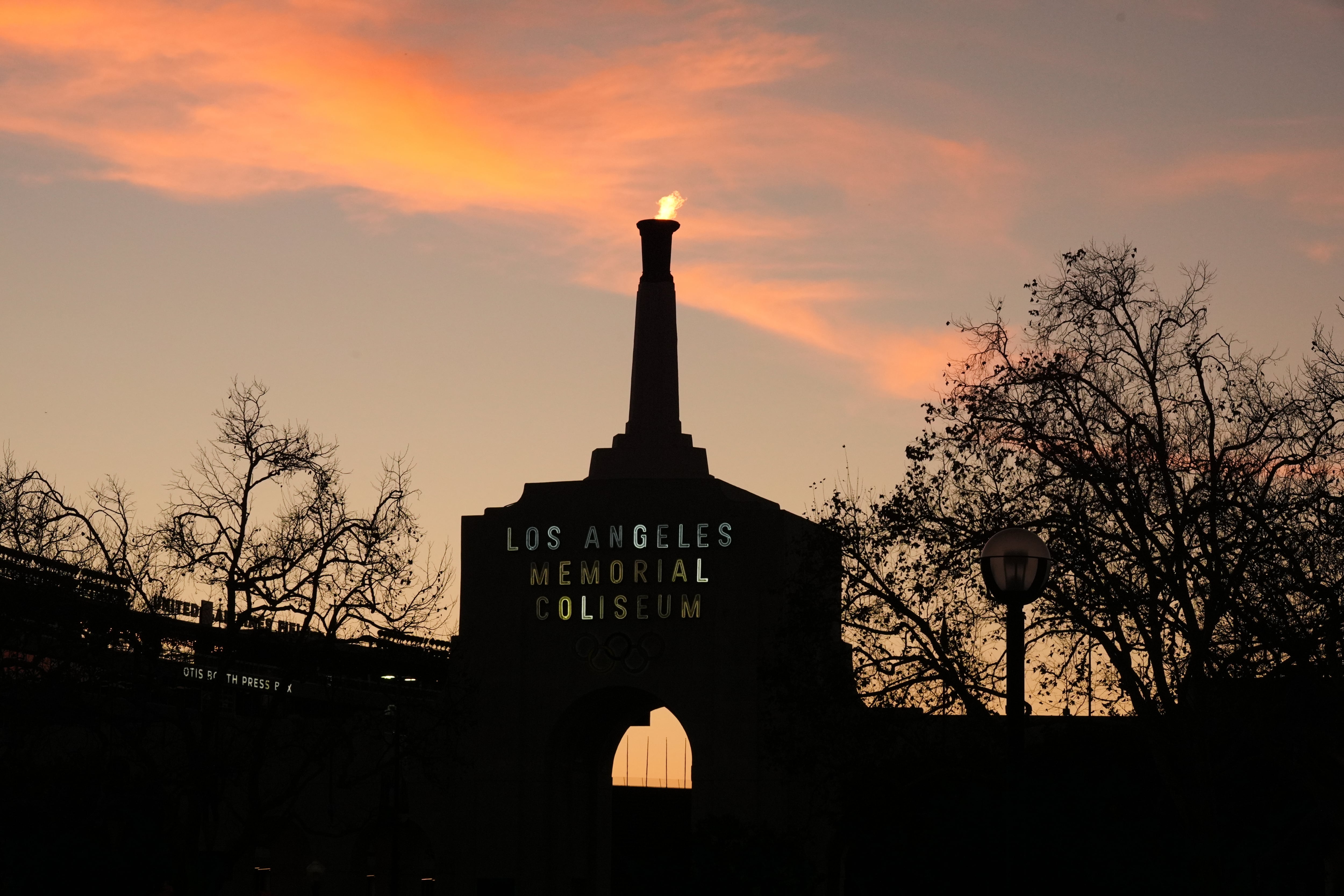 The Olympic cauldron is lit at the Los Angeles Memorial Coliseum on Jan. 13. The City Council is proposing a 10% tax on 2028 Summer Olympics tickets, something Utah is undecided on for the 2034 Winter Olympics.