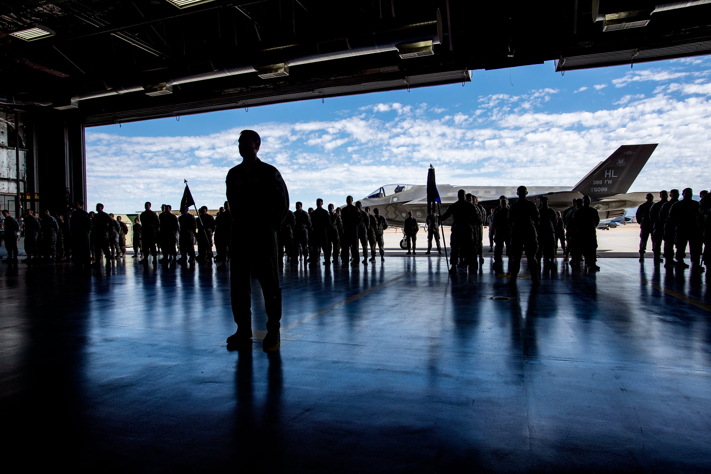 Members of the 388th Fighter Wing at Hill Air Force Base near Ogden stand at attention during a ceremony on June 24, 2019. The base may receive a funding boost for a new F-35 repair facility in a provision in a military spending bill passed this week.