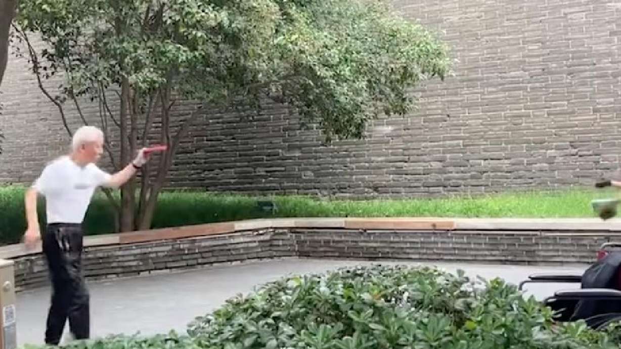 Two men play ping pong without a table in Shaanxi, China, on Dec. 10, 2025.
