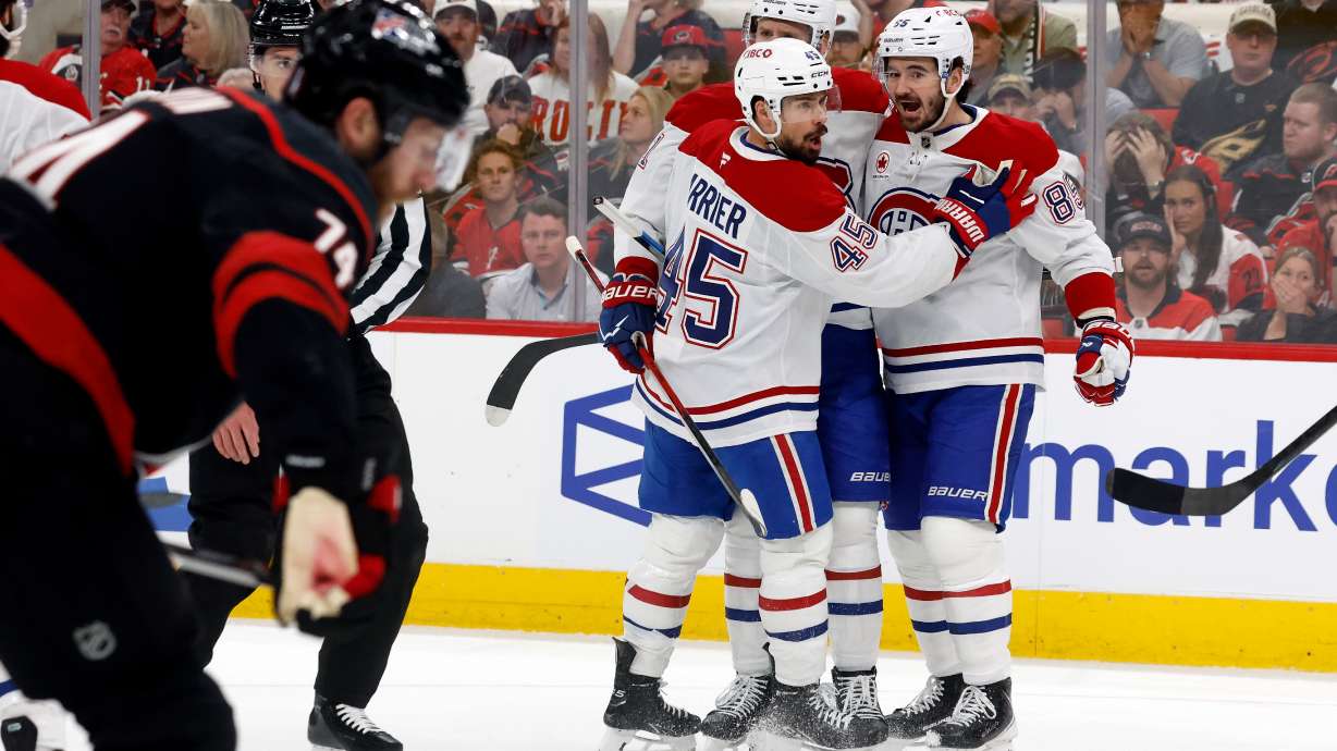 Montréal Canadiens celebrate their third goal during the first period in Game 1 of the Eastern Conference finals NHL hockey Stanley Cup playoffs series against the Carolina Hurricanes in Raleigh, N.C., Thursday, May 21, 2026.