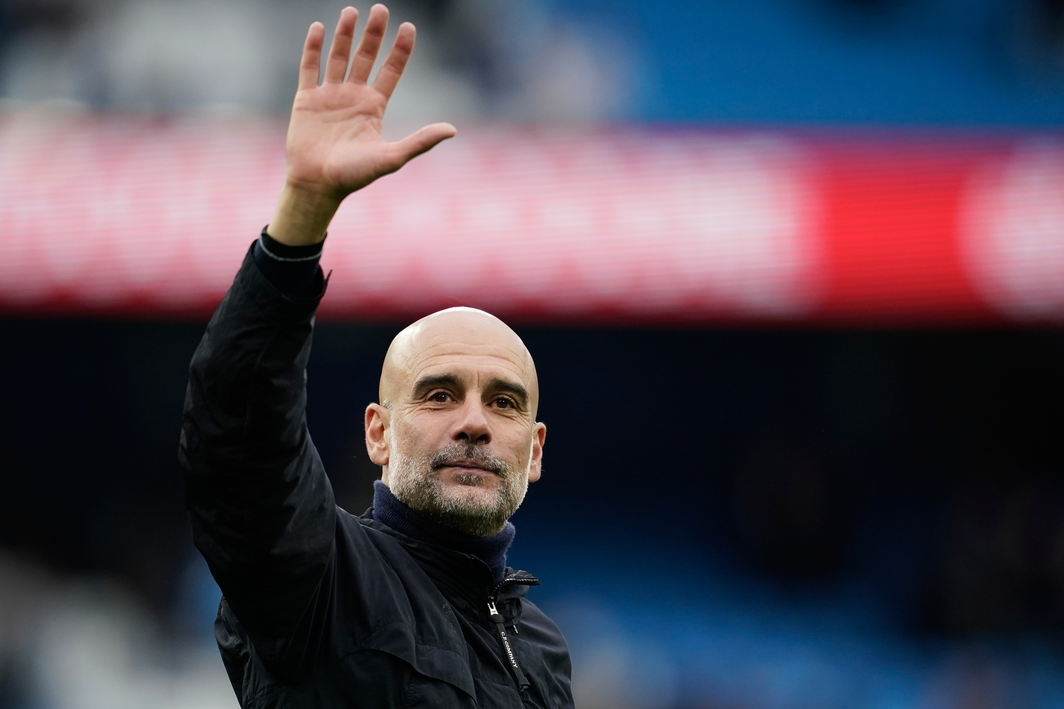 FILE - Manchester City's head coach Pep Guardiola greets fans at the end of the English Premier League soccer match between Manchester City and Brentford in Manchester, Saturday, May 9, 2026. 