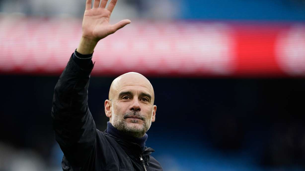 FILE - Manchester City's head coach Pep Guardiola greets fans at the end of the English Premier League soccer match between Manchester City and Brentford in Manchester, Saturday, May 9, 2026.