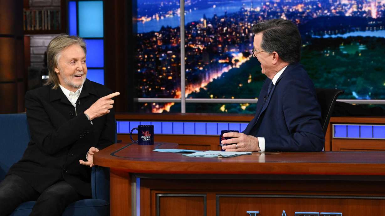 Paul McCartney with host Stephen Colbert during the final episode of "The Late Show with Stephen Colbert" in New York on Thursday. McCartney was part of a long list of guests to help Colbert say goodbye to late-night TV.