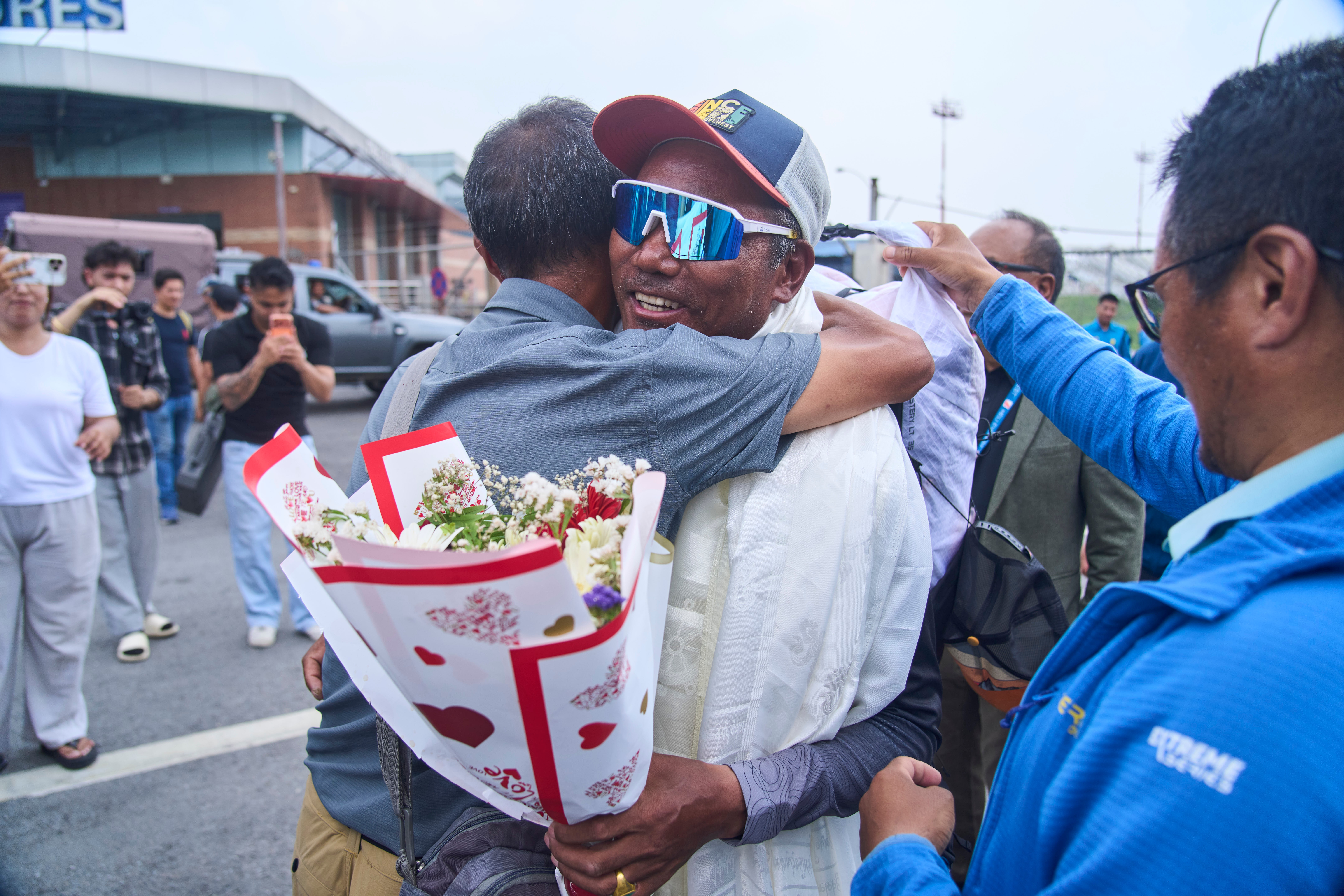Everest record-holder Kami Rita Sherpa urges limit on climbers as crowds swell on the peak