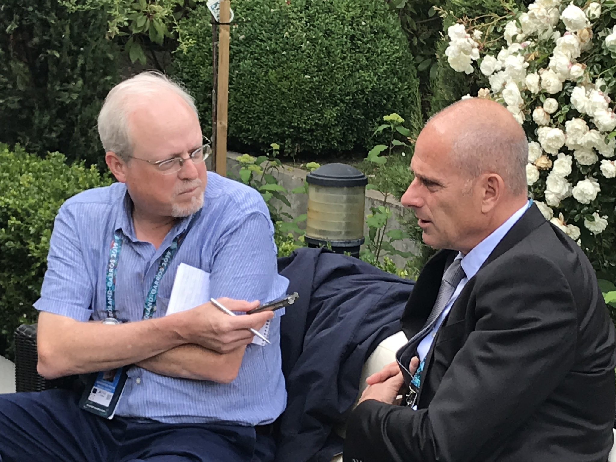 Howard Fendrich, left, Associated Press national sports writer, interviews former French tennis player Guy Forget at the 2019 French Open tennis tournament in Paris. 