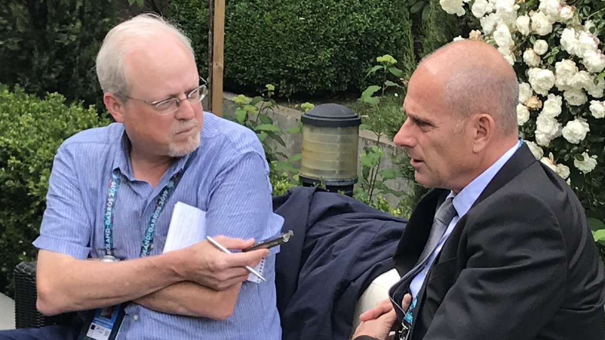 Howard Fendrich, left, Associated Press national sports writer, interviews former French tennis player Guy Forget at the 2019 French Open tennis tournament in Paris.