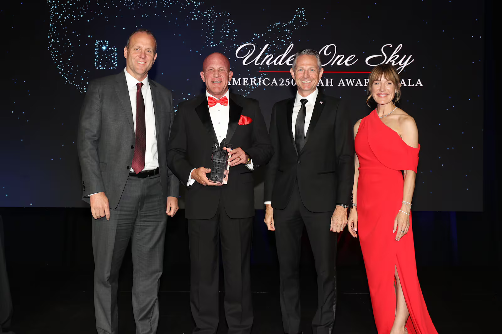 Rob Allen accepts the Steward of the Sky Award on behalf of Intermountain Health during the Salt Lake Chamber's "Under One Sky America 250 Utah Awards Gala" at Grand America on Thursday. The award honors an organization that acts with integrity, responsibility, and is committed to community.