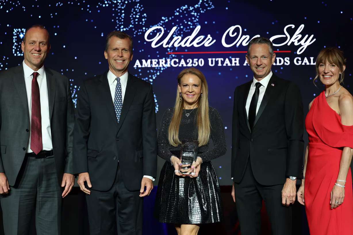 David Huntsman and Christine Huntsman accept the Milky Way Award on behalf of the Huntsman Family Foundation during the Salt Lake Chamber's "Under One Sky America 250 Utah Awards Gala" at Grand America Hotel on Thursday. The award honors an organization that "creates a constellation of service across the community."