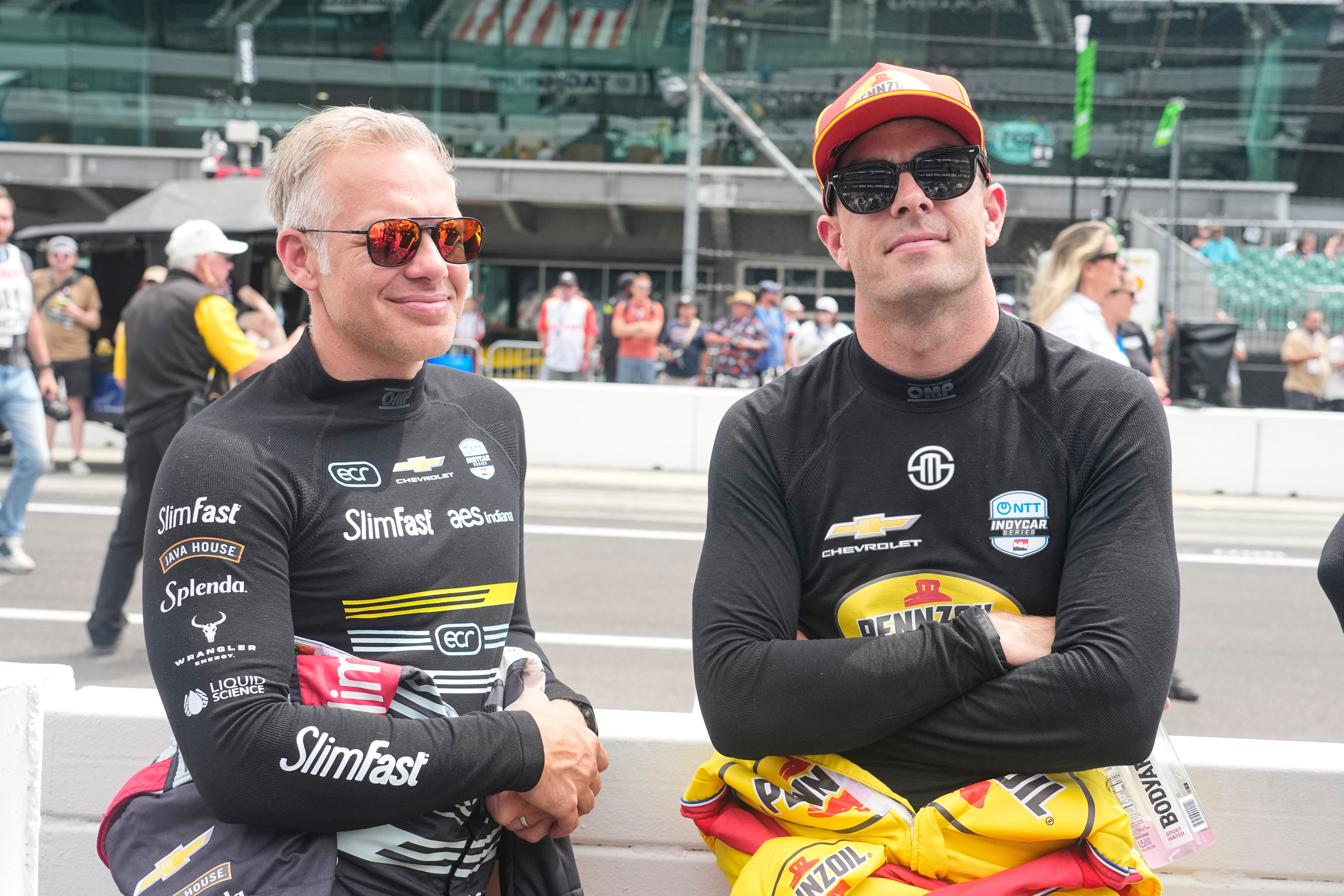 Ed Carpenter, left, talks with Scott McLaughlin before practice for the Indianapolis 500 auto race at the Indianapolis Motor Speedway in Indianapolis, Monday, May 18, 2026. 