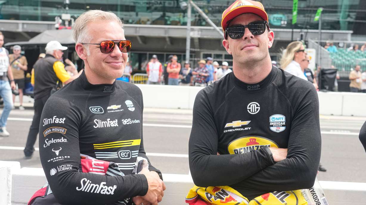 Ed Carpenter, left, talks with Scott McLaughlin before practice for the Indianapolis 500 auto race at the Indianapolis Motor Speedway in Indianapolis, Monday, May 18, 2026.