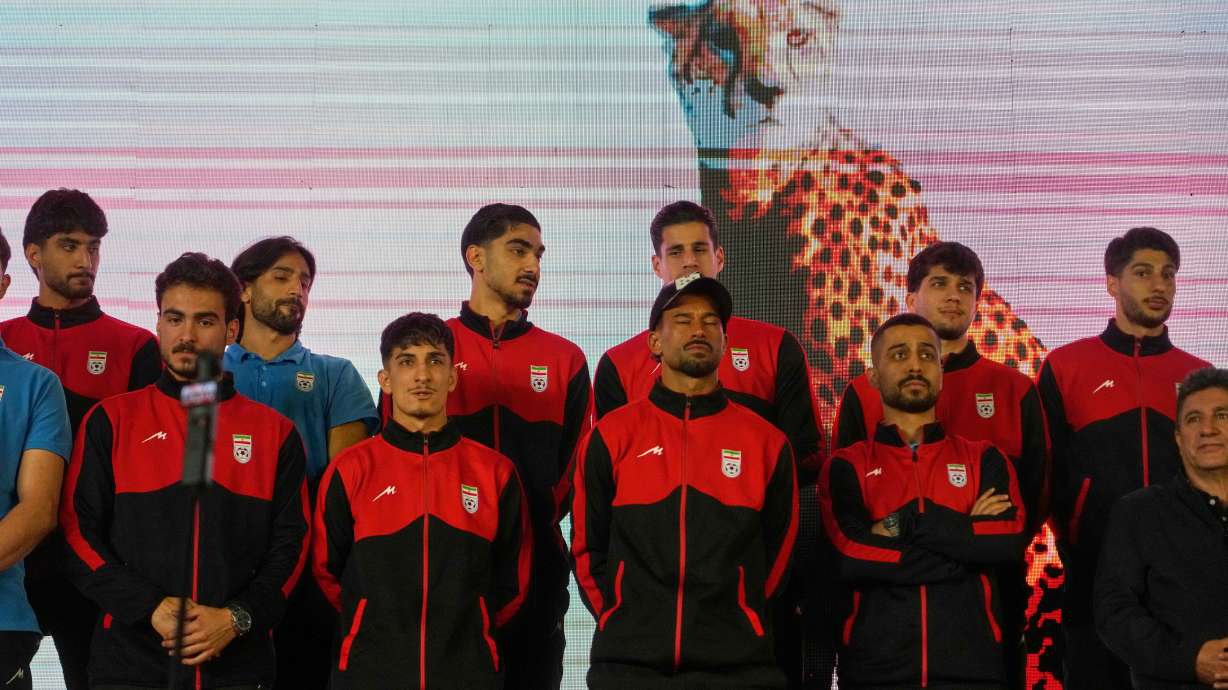 Iran's national soccer team players stand onstage as they are greeted by a crowd during a pro-government gathering before their departure for training and friendly matches in Turkey ahead of the World Cup at Islamic Revolution Square in Tehran, Iran, Wednesday, May 13, 2026.