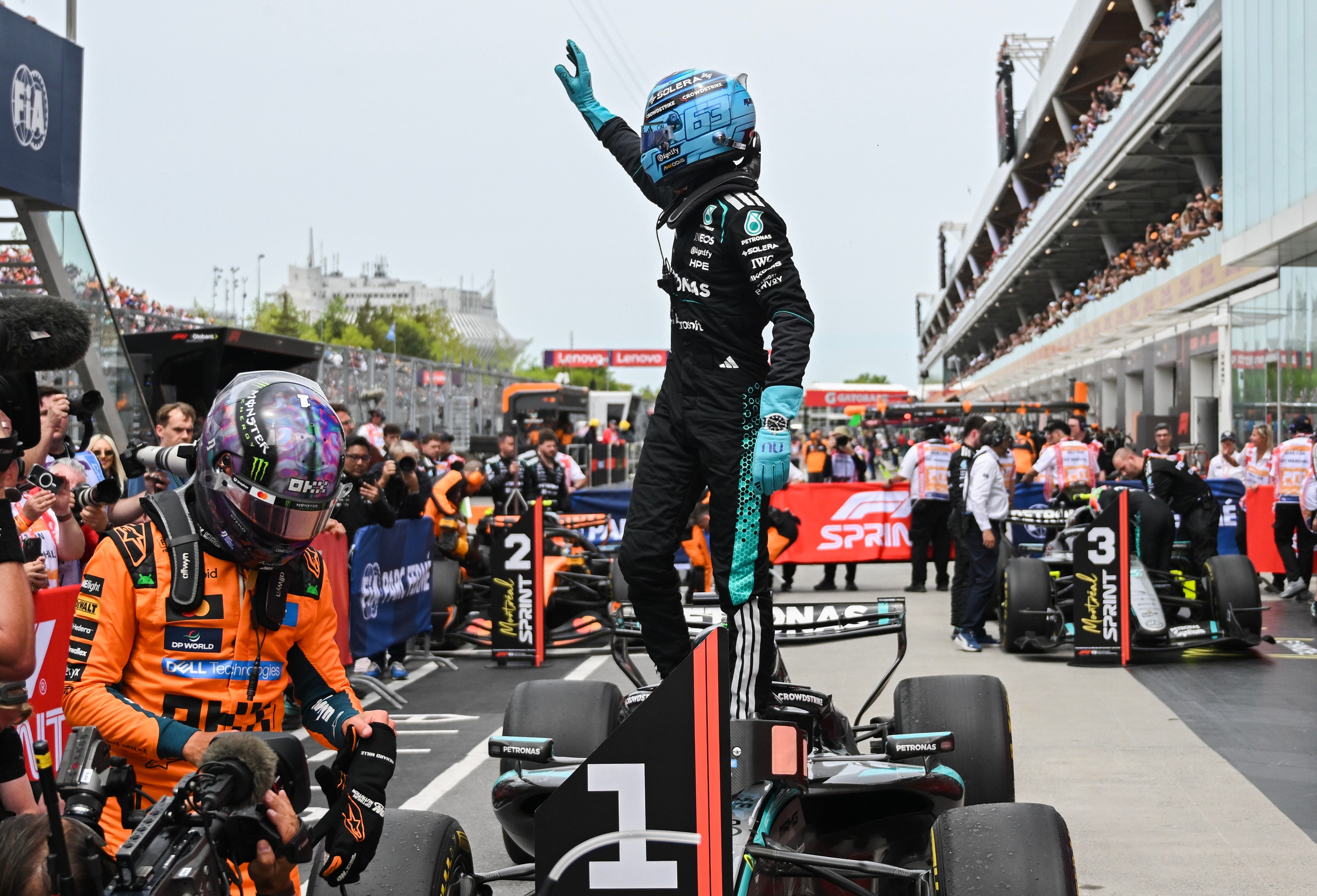 Mercedes driver George Russell, of Britain, waves after winning the sprint race at the F1 Canadian Grand Prix auto race in Montreal, Saturday, May 23, 2026. 