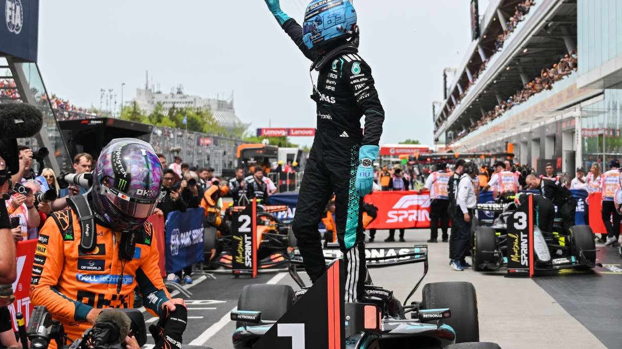 Mercedes driver George Russell, of Britain, waves after winning the sprint race at the F1 Canadian Grand Prix auto race in Montreal, Saturday, May 23, 2026.