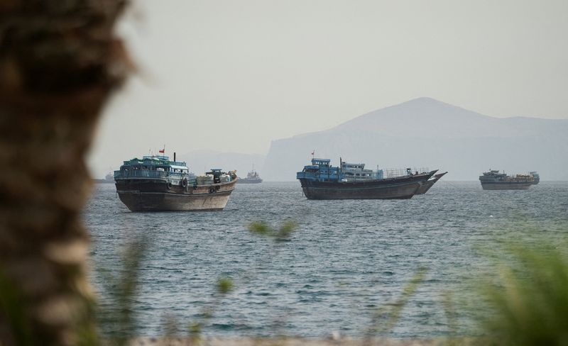 Vessels sail through the Strait of Hormuz in Musandam, Oman, Friday. President Donald Trump said on Saturday that a deal to end the Iran war, including opening the Strait of Hormuz, was "largely negotiated."