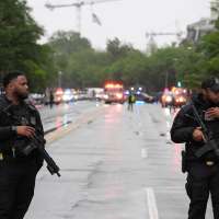 Law enforcement authorities respond to reports of shots fired near White House
