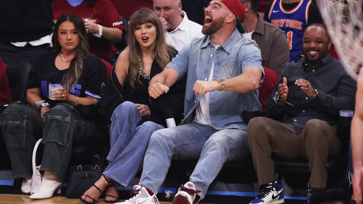 Taylor Swift and Travis Kelce watch the first half of Game 3 in the Eastern Conference finals NBA basketball playoffs series between the New York Knicks and the Cleveland Cavaliers in Cleveland, Saturday, May 23, 2026.