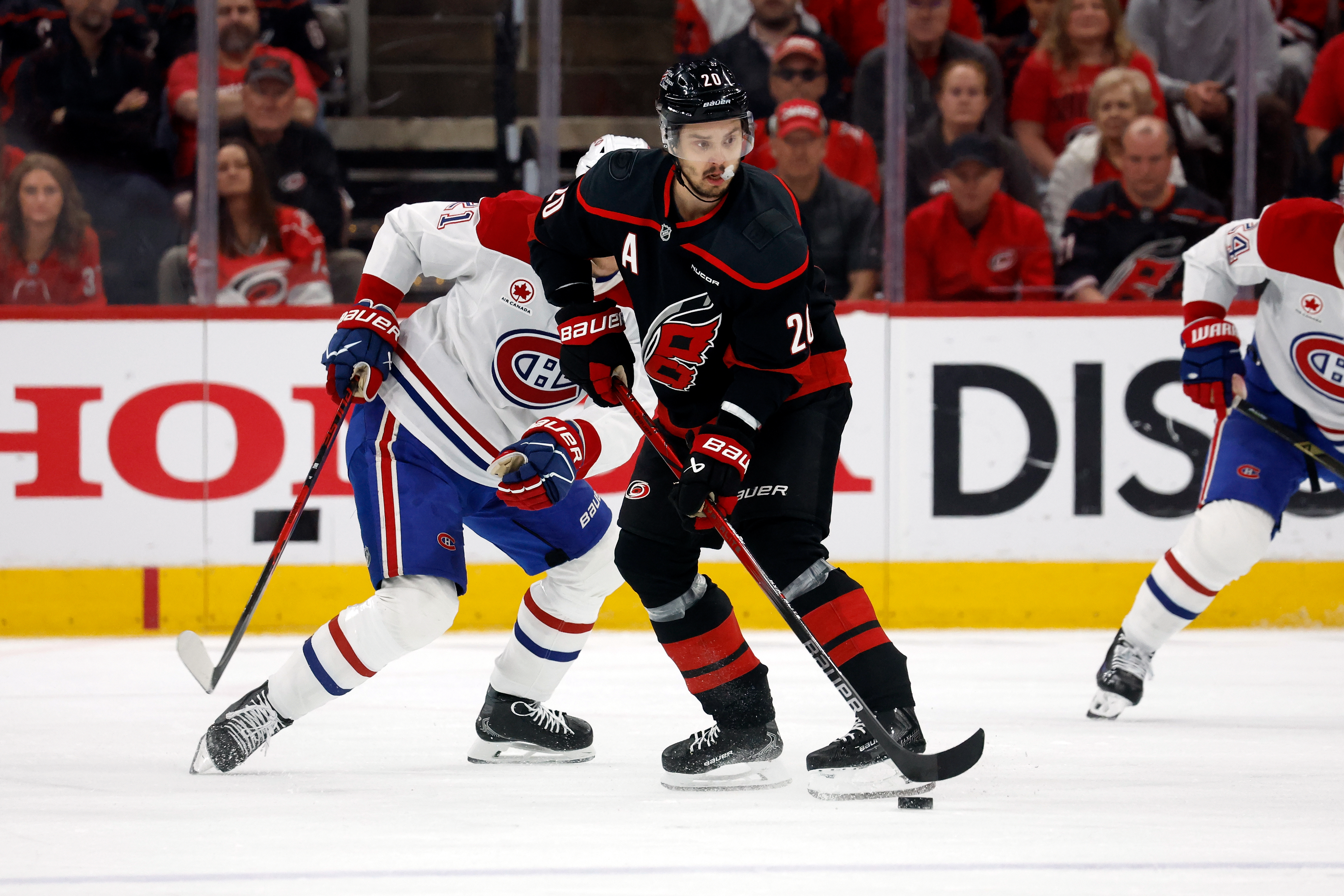 Carolina Hurricanes' Sebastian Aho (20) controls the puck against the Montreal Canadiens during the first period in Game 2 of the Eastern Conference finals NHL hockey Stanley Cup playoff series in Raleigh, N.C., Saturday, May 23, 2026. 