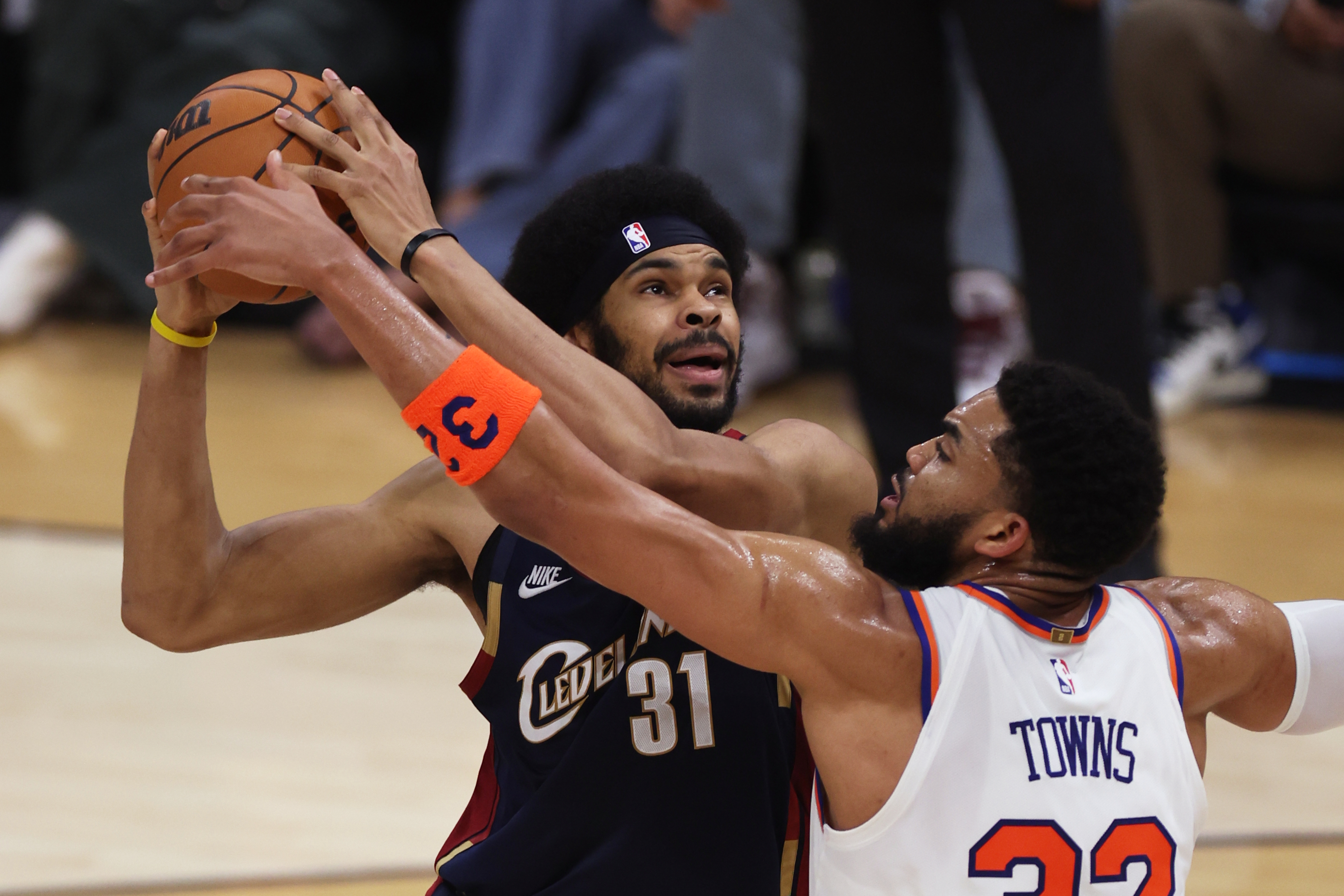 New York Knicks center Karl-Anthony Towns (32) defends against Cleveland Cavaliers center Jarrett Allen (31) during the first half of Game 3 in the Eastern Conference finals NBA basketball playoffs series in Cleveland, Saturday, May 23, 2026. 