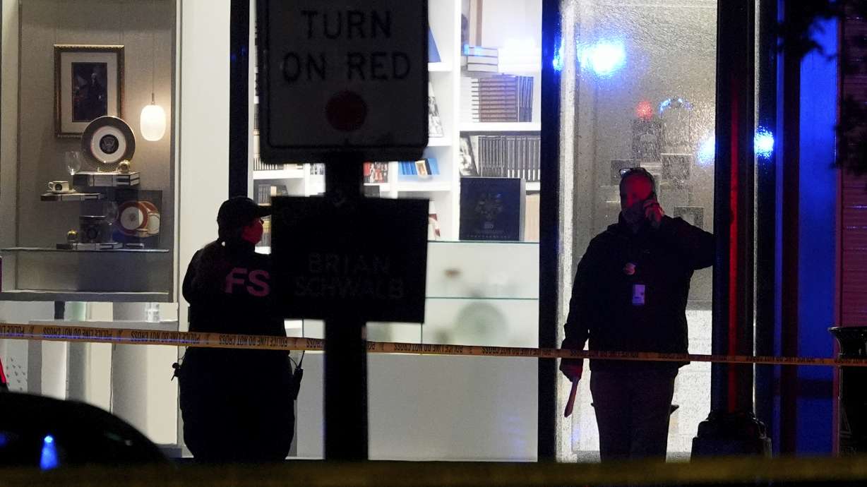 Secret Service police at a crime scene near the White House, Saturday, in Washington. The Secret Service says a man who opened fire near a White House security checkpoint is dead.