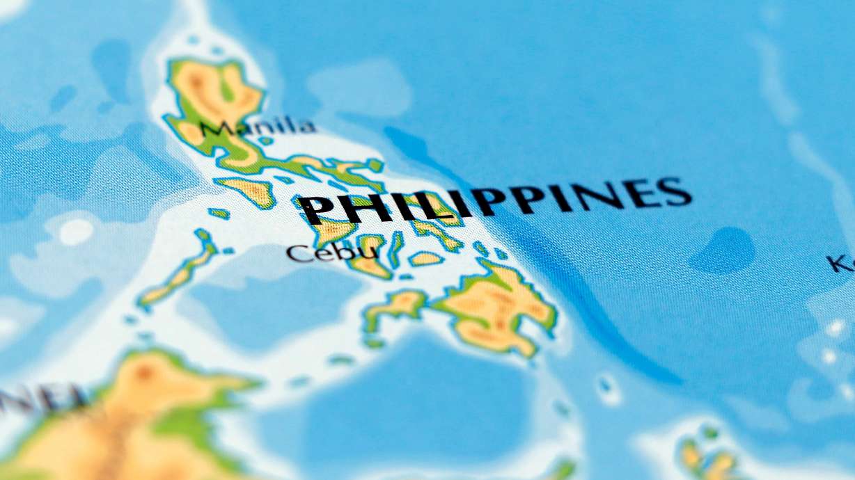 Two people feared trapped after a building collapse in the Philippines were alive and communicating with rescuers on Sunday, an official said, as rescue efforts continued.