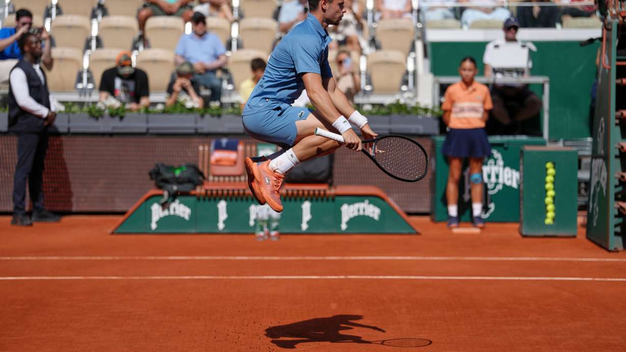 Arthur Gea of France warms up before the first round men's singles tennis match against Karen Khachanov of Russia at the French Open tennis tournament in Paris, Sunday, May 24, 2026.