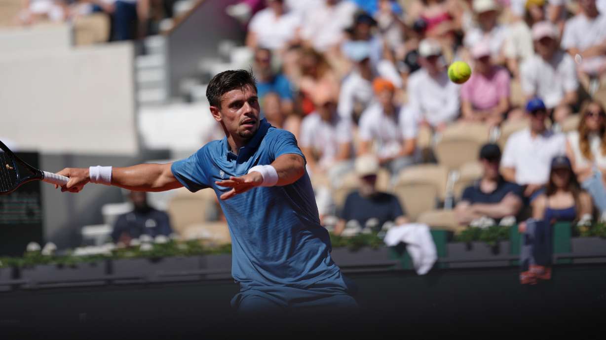 Arthur Gea of France returns to Karen Khachanov of Russia during the first round men's singles tennis match at the French Open tennis tournament in Paris, Sunday, May 24, 2026.