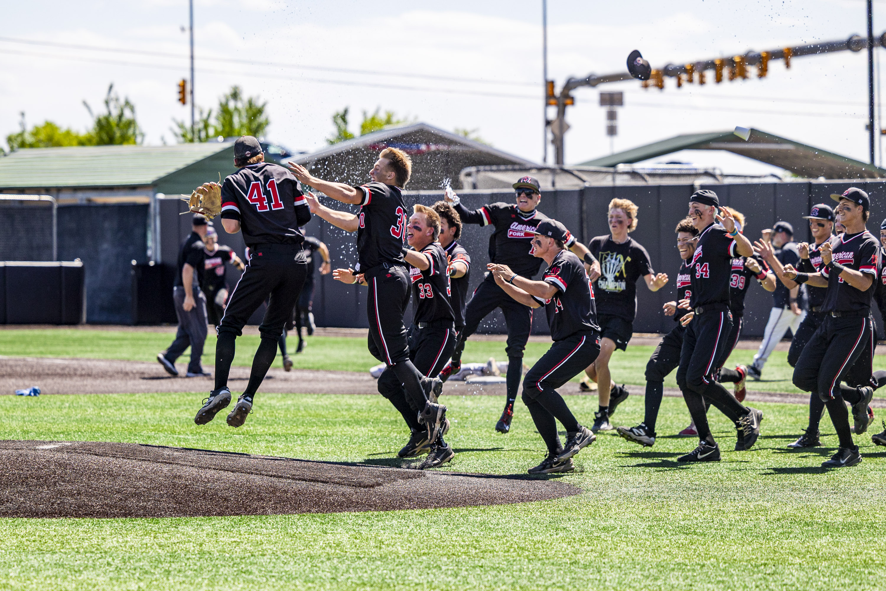 American Fork players celebrate just after defeating Skyridge 5-3 in the second and final game of the 6A baseball state championship series, held at UCCU Ballpark in Orem on Saturday, May 23, 2026.