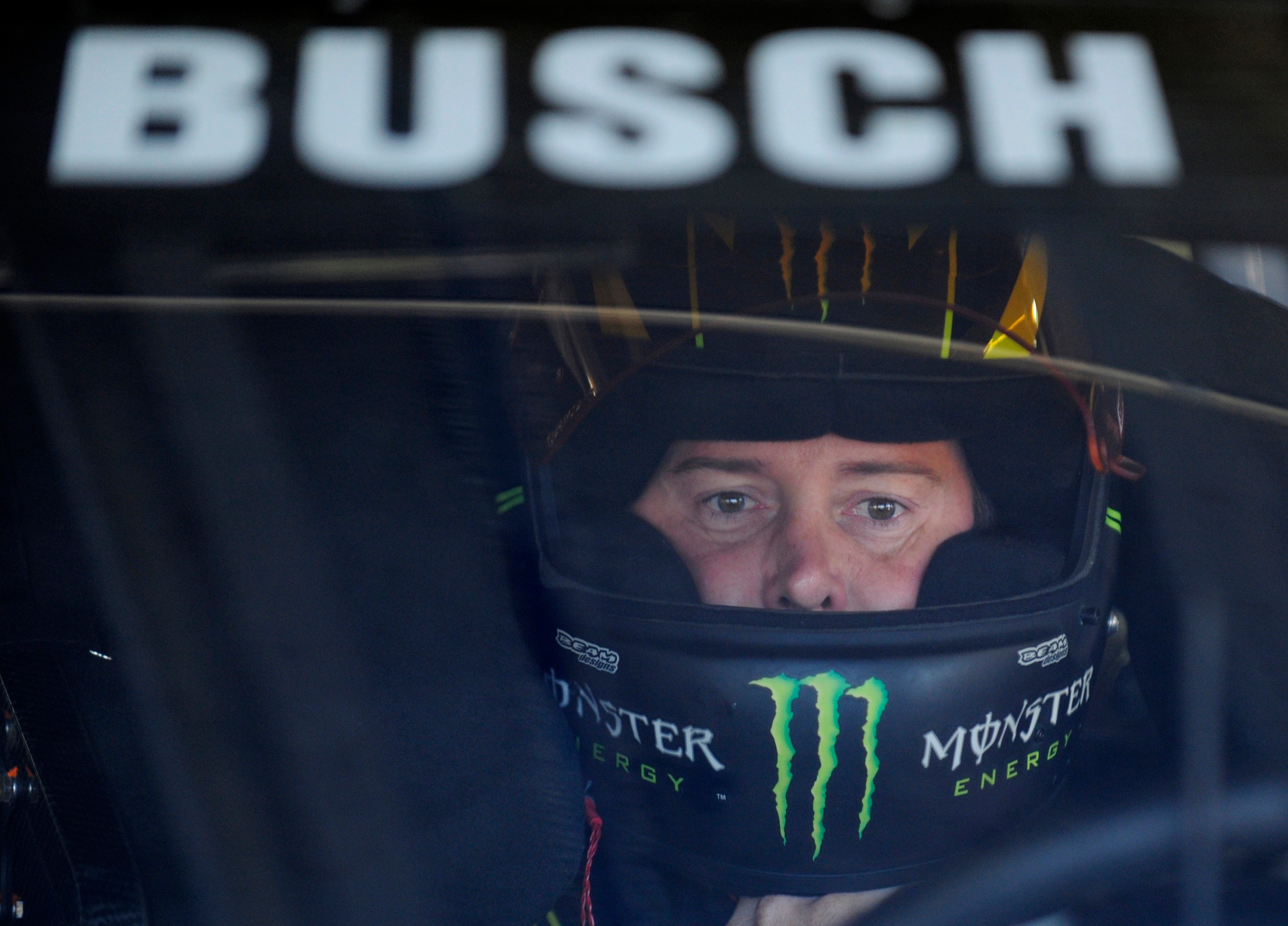 FILE - Kurt Busch waits in his car before practice for Sunday's NASCAR Sprint Cup series Coca-Cola 600 auto race at Charlotte Motor Speedway in Concord, N.C., Saturday, May 25, 2013.  CORRECTION: Driver ID corrected to Kurt Busch, not Kyle Busch.