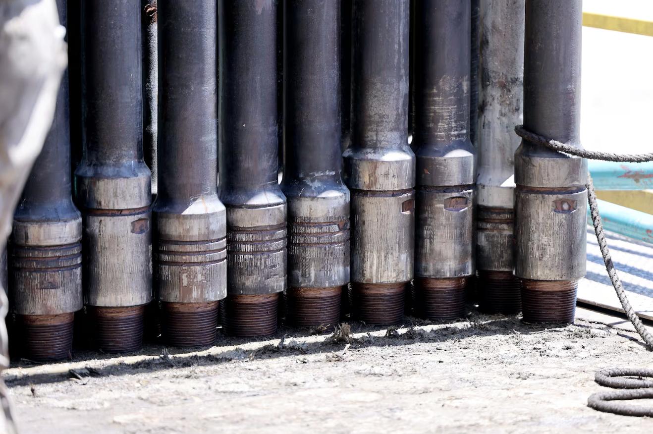 Pipes stand in a bunch waiting to be placed down the hole at a rig at the FORGE geothermal demonstration sight near Milford on July 6, 2023.