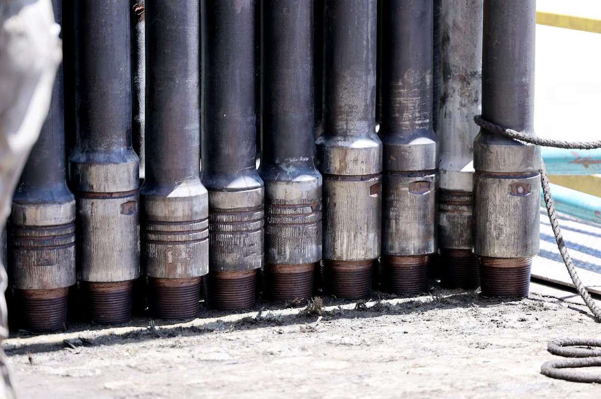 Pipes stand in a bunch waiting to be placed down the hole at a rig at the FORGE geothermal demonstration sight near Milford on July 6, 2023.
