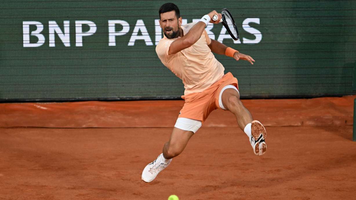 Novak Djokovic of Serbia returns to Giovanni Mpetshi Perricard of France during their first round men's singles tennis match at the French Open tennis tournament in Paris, Sunday, May 24, 2026.