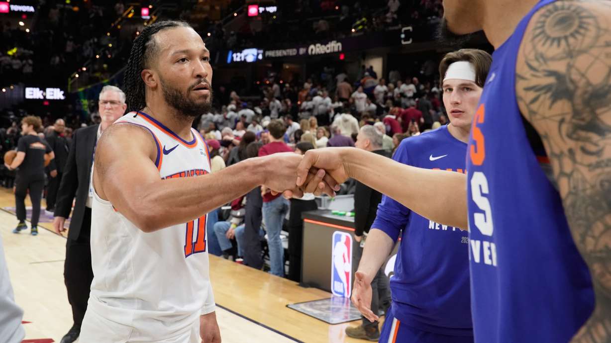 New York Knicks guard Jalen Brunson (11) celebrates with teammates after winning Game 3 in the Eastern Conference finals NBA basketball playoffs series against the Cleveland Cavaliers in Cleveland, Saturday, May 23, 2026.