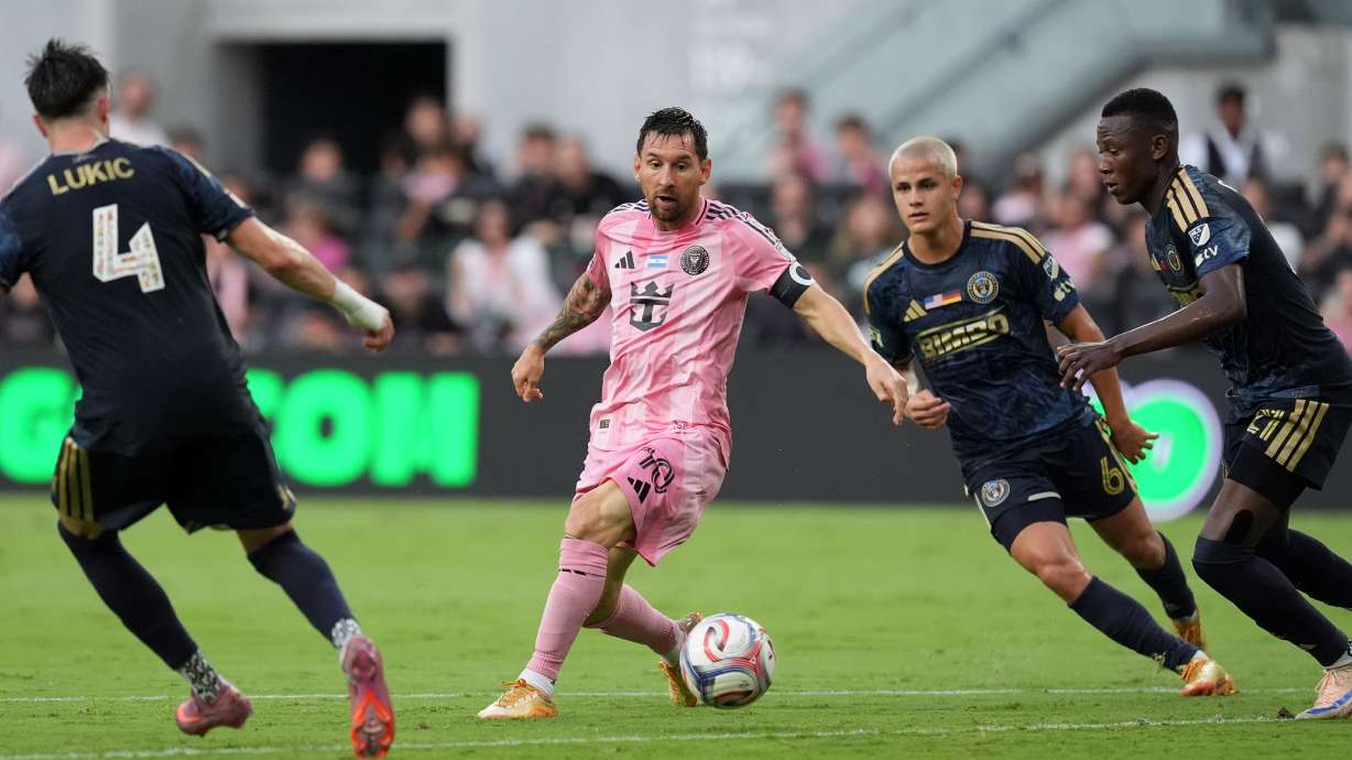 Inter Miami forward Lionel Messi (10) comes under pressure from Philadelphia Union midfielder Jovan Lukic (4), midfielder Cavan Sullivan (6), and midfielder Danley Jean Jacques (21), during the first half of an MLS soccer match, Sunday, May 24, 2026, in Miami.